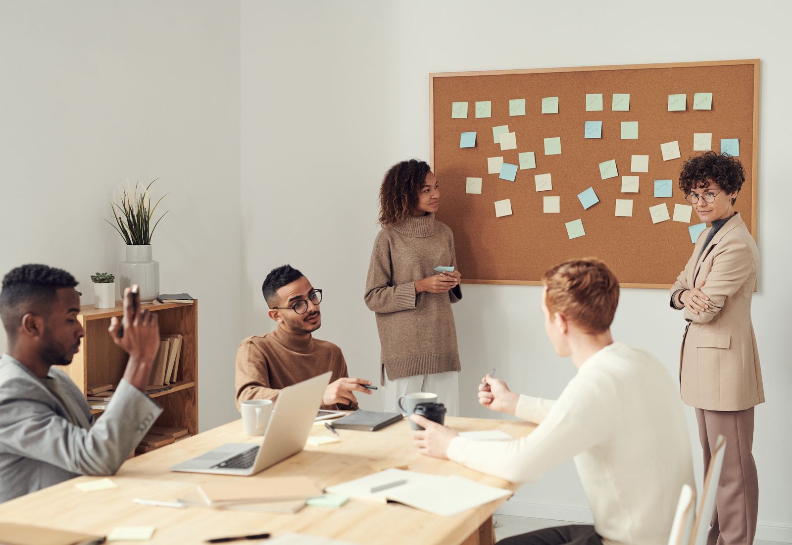 Founder and consultant mapping a roadmap on sticky notes